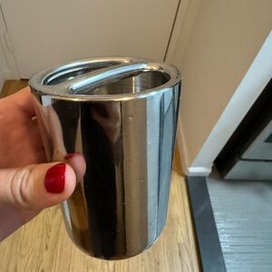 Silver tooth brush holder.